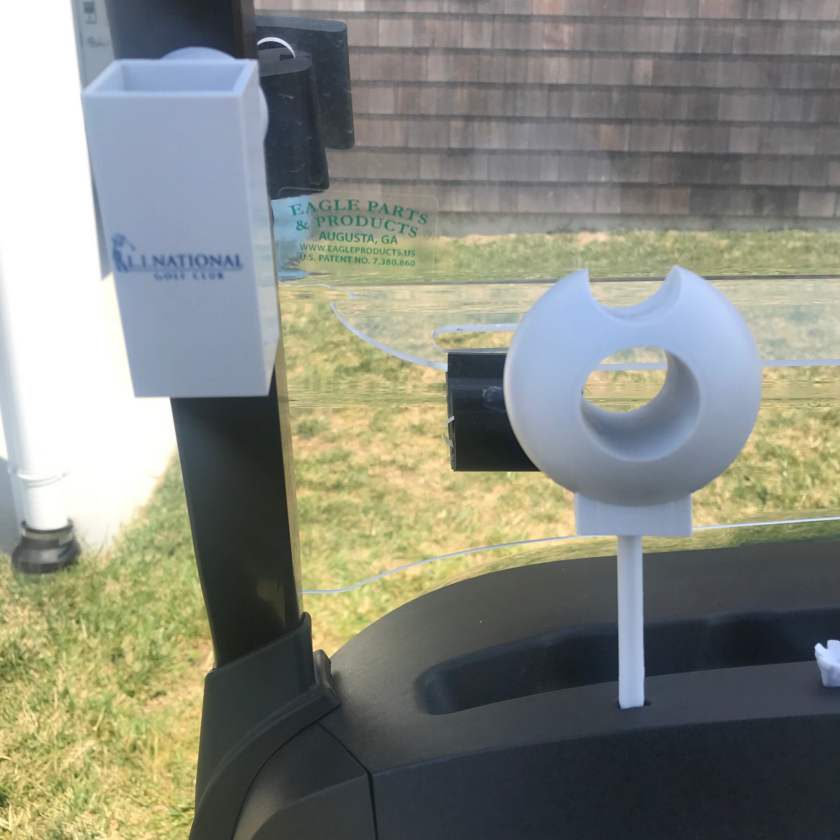 BogeyforStogies two-part magnetic cigar holder attached to a golf cart, with a cigar stand inserted into the cart’s tee holder