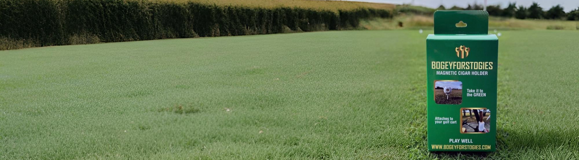 Box of Bigfootures products on a grassy field with cornfield in the background