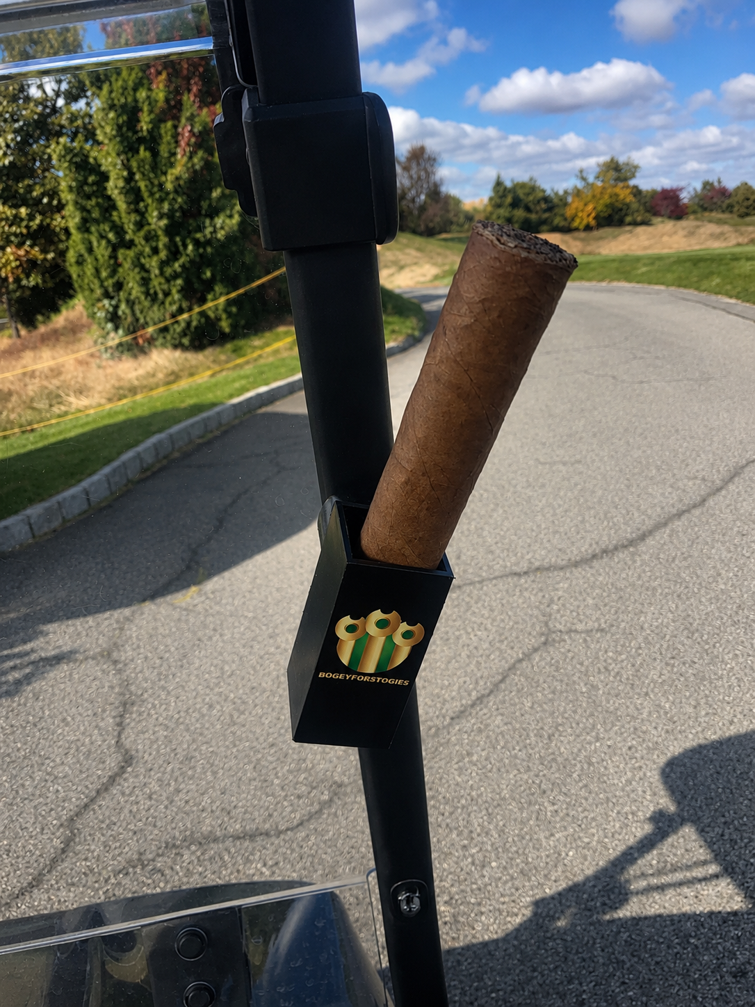 BogeyforStogies magnetic cigar holder securing a cigar to a golf cart frame